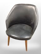 A 20th century Danish black vinyl upholstered chair on teak legs