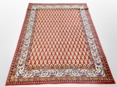 A machine made Persian design rug 200 cm x 136 cm