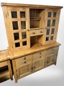 A contemporary solid oak kitchen dresser fitted cupboards and drawers,