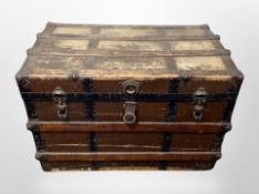 A 19th century oak canvas and metal bound shipping trunk,