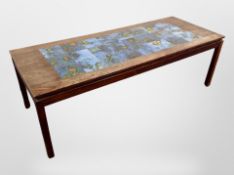 A Danish rosewood veneered and tiled topped rectangular coffee table,