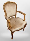 A continental beech framed salon chair in beige dralon upholstery