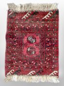 A small Afghan Bokhara rug 77 cm x 53 cm