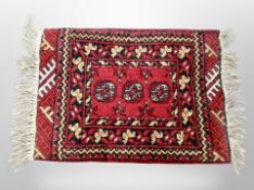 A small Afghan Bokhara rug 86 cm x 52 cm