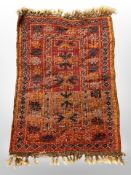 A small Afghan/Caucasian rug,