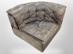 A late 20th century Danish black leather corner chair,