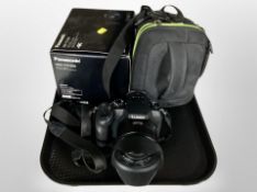 A Panasonic Lumix DMC-FZ1000 digital camera with Leica lens and camera bag