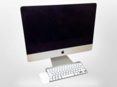 An Apple iMac computer model A1418, with lead, keyboard and mouse.