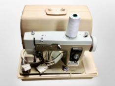 A Newhome electric sewing machine with lead and pedal
