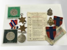 Three WWII service medals, a silver ARP badge, other decorations,