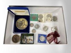 A collection of coins, commemorative crowns,