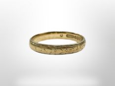 An 18ct yellow gold band ring, size N. CONDITION REPORT: Ring is miss shaped. 3.3g.
