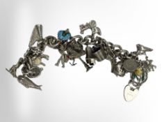 A silver charm bracelet 73.6g.