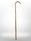 An antique child's bamboo walking cane,