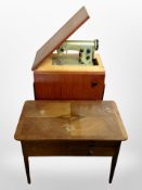 A Husqvarna sewing machine in teak cabinet and an early 20th century figured walnut work table,