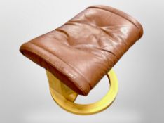 A Scandinavian brown leather footstool