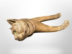 A carved wooden nut cracker in the form of a cat,