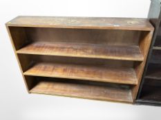 A stained pine open bookcase,