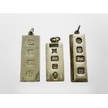 Three silver ingot pendants, longest 42mm. CONDITION REPORT: 59.5g.