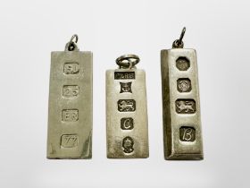 Three silver ingot pendants, longest 42mm. CONDITION REPORT: 59.5g.