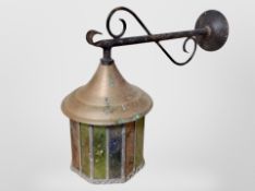 A metal and leaded glass wall lantern,