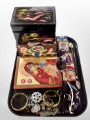 A group of modern Russian style icons, lacquered jewellery box, brass bangles, costume jewellery,