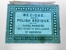 A pack of Thos De La Rue & Co. Bezique and Polish Bezique with cards and markers.