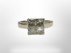 An 18ct white gold pie-cut diamond ring, size I, the four square cut diamonds each approximately 0.