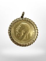 A George V gold full sovereign 1911 in yellow gold pendant mount CONDITION REPORT: 9.