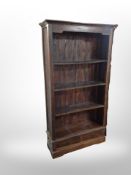 A stained pine open bookcase,