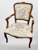 A continental carved and stained beech salon armchair