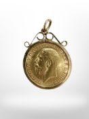A George V gold half sovereign 1914 in 9ct gold pendant mount CONDITION REPORT: 5.