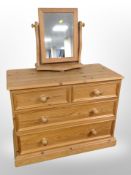 A contemporary pine four drawer low chest,