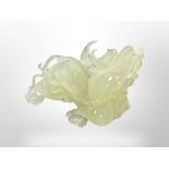 A carved jade Dragon, height 9 cm, length 12 cm.