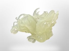 A carved jade Dragon, height 9 cm, length 12 cm.