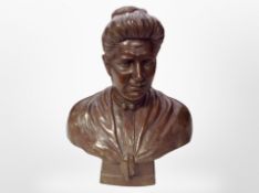 A Continental cast bronze bust of a woman, initialled CM and dated 1911,