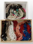 Two trays of beaded necklaces,