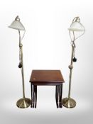 A pair of contemporary brass standard lamps and a reproduction mahogany nest of three tables,