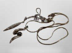 A spear shaped silver pendant on fancy twist silver chain and a further silver Z-shaped pendant on