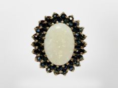 A good quality yellow gold opal and sapphire ring