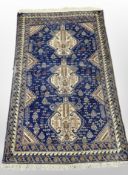 A Caucasian rug on indigo ground,