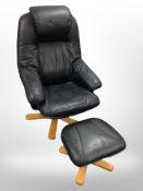 A black leather swivel armchair and matching footstool