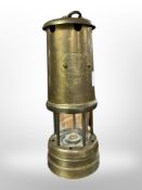 A Lamp & Limelight brass miner's lamp