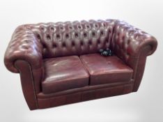 A Chesterfield oxblood leather two seater settee,