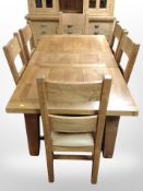 A contemporary solid oak extending dining table ,