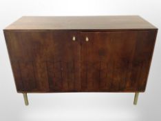 A contemporary stained pine double door low cabinet,