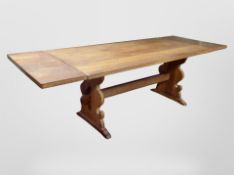 A 20th century Scandinavian oak drop end extending dining table,