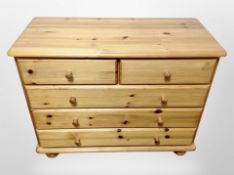A pine five drawer chest,