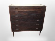 A 1970's Danish simulated rosewood six drawer chest,