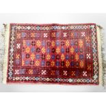 A small Afghan Balouch rug 77 cm x 44 cm